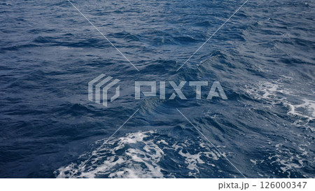 Side view from boat in Indian ocean sailing between Seychelles islands in daytime 126000347