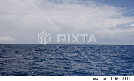 Side view from boat in Indian ocean sailing between Seychelles islands in daytime 126000348