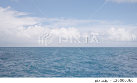 Side view from boat in Indian ocean sailing between Seychelles islands in daytime Side view from boat in Indian ocean sailing between Seychelles islands in daytime 126000360