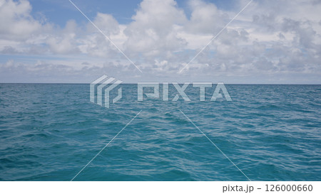 Side view from boat in Indian ocean sailing between Seychelles islands in daytime Side view from boat in Indian ocean sailing between Seychelles islands in daytime 126000660
