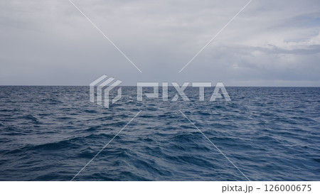 Side view from boat in Indian ocean sailing between Seychelles islands in daytime Side view from boat in Indian ocean sailing between Seychelles islands in daytime 126000675