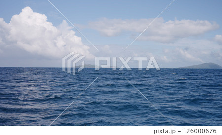 Side view from boat in Indian ocean sailing between Seychelles islands in daytime Side view from boat in Indian ocean sailing between Seychelles islands in daytime 126000676