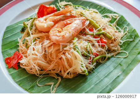 Top view of Stir Fried Spicy Rice Vermicelli and Water Mimosa with Shrimps, focus selective Top view of Stir Fried Spicy Rice Vermicelli and Water Mimosa with Shrimps, focus selective 126000917