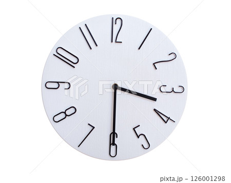 Minimalist Round Wall Clock Showing 03:30 or 15:30. Thin Black Numerals on White Wood Background. 126001298