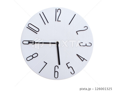 Minimalist Round Wall Clock Showing 05:45 or 17:45. Thin Black Numerals on White Wood Background. Minimalist Round Wall Clock Showing 05:45 or 17:45. Thin Black Numerals on White Wood Background. 126001325