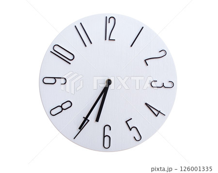 Minimalist Round Wall Clock Showing 06:35 or 18:35. Thin Black Numerals on White Wood Background. 126001335