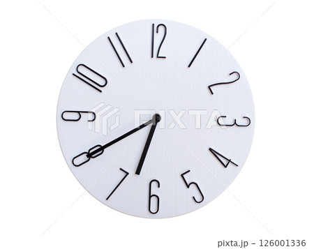 Minimalist Round Wall Clock Showing 06:40 or 18:40. Thin Black Numerals on White Wood Background. 126001336
