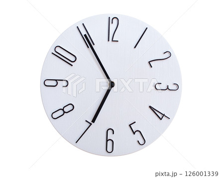 Minimalist Round Wall Clock Showing 06:55 or 18:55. Thin Black Numerals on White Wood Background. 126001339