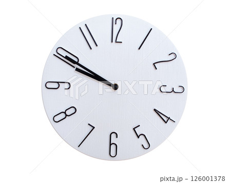 Minimalist Round Wall Clock Showing 09:50 or 21:50. Thin Black Numerals on White Wood Background. 126001378
