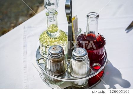 Condiment Tray with Oil, Vinegar, Salt, and Pepper on Café Table Condiment Tray with Oil, Vinegar, Salt, and Pepper on Café Table 126005163