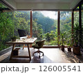 Modern Home Office Interior with Natural Light and Large Glass Windows Overlooking Lush Green Forest, Minimalist Workspace Design with Wooden Desk, Indoor Plants, and Serene Eco Friendly Atmosphere 126005541
