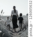 Tranquil family walk in nature, summer outdoor exploration, calm bonding moments, walking path with kids 126005632