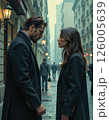 Urban romance encounter in foggy street - moody evening scene with architectural elegance and stylish attire 126005639