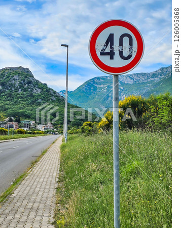 Road sign on the road: speed limit and pedestrian crossings 126005868