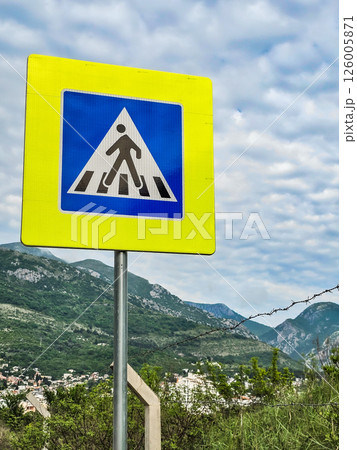 Road sign on the road: speed limit and pedestrian crossings Road sign on the road: speed limit and pedestrian crossings 126005871