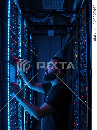 Data center expertise: professional managing secure server infrastructure with modern technology 126005969