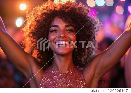 Joyful celebration portrait with glittering dress and vibrant lighting 126006147
