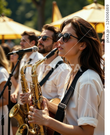 Vibrant jazz ensemble performing live outdoors at summer festival 126006869