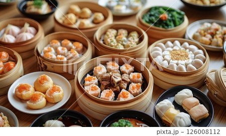Authentic Chinese cuisine displayed on dining tables 126008112