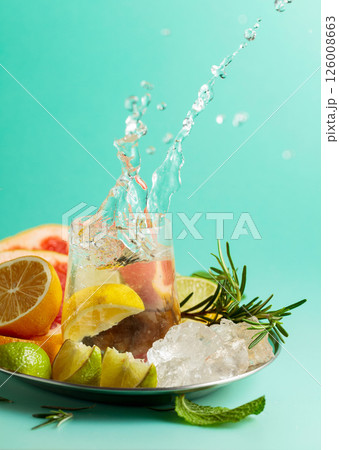 A refreshing summer drink with ice, citrus, rosemary and mint. 126008663