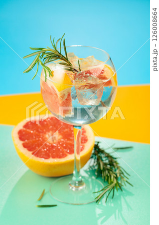 Refreshing summer cocktail with gin, tonic, grapefruit, and rosemary. 126008664