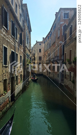 Picturesque view of a Venice canal taken from a bridge. Historic buildings with colorful facades 126008822