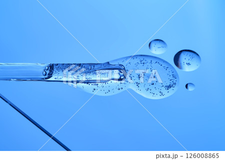Anti-aging wrinkle serum on a blue background. Anti-aging wrinkle serum on a blue background. 126008865