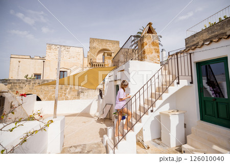 Sunlit steps and historic walls 126010040