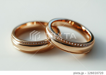 Pair of Wedding Rings on a white background. 126010720