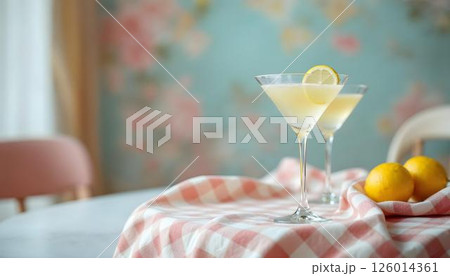 A joyful arrangement showcases two glasses of lemonade and a vase of spring flowers on a table, making it perfect for cocktails A joyful arrangement showcases two glasses of lemonade and a vase of spring flowers on a table, making it perfect for cocktails 126014361