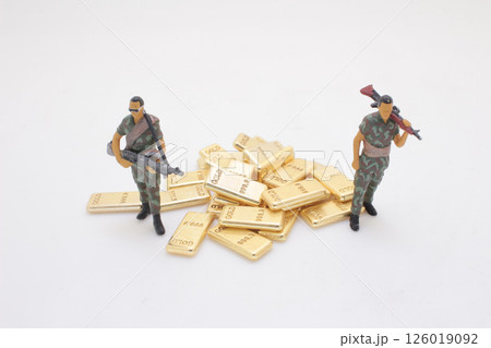 Toy Soldiers Protecting Pile of Gold Bars on White Background Toy Soldiers Protecting Pile of Gold Bars on White Background 126019092