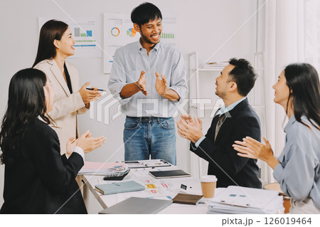 Team of financial advisory services. Asian advisor showing plan of investment to clients in the consultancy office. Team of financial advisory services. Asian advisor showing plan of investment to clients in the consultancy office. 126019464