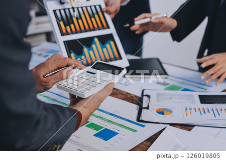 Accounting company provide finance and taxation planning for profitable cash flow, Auditor and accountant team working in office, analyze financial data and accounting record with calculator.Insight Accounting company provide finance and taxation planning for profitable cash flow, Auditor and accountant team working in office, analyze financial data and accounting record with calculator.Insight 126019805