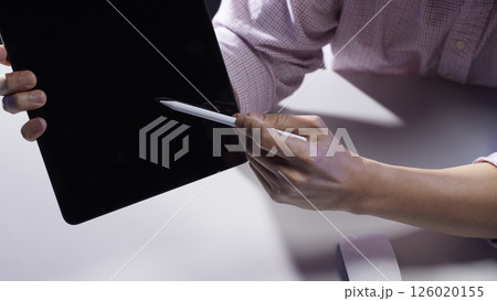 People working together and sharing ideas in a modern business environment. 126020155