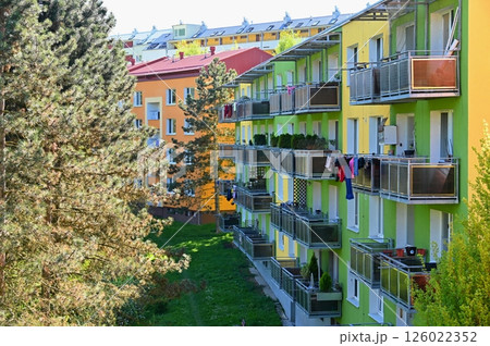 Facade of a modern apartment building with windows and balconies. Czech Republic - Europe.. Original prefabricated houses on a housing estate from the communist era in Eastern and Central Europe after Facade of a modern apartment building with windows and balconies. Czech Republic - Europe.. Original prefabricated houses on a housing estate from the communist era in Eastern and Central Europe after 126022352