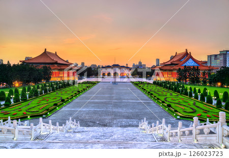 Liberty Square in Taipei, Taiwan, viewed at sunset with the National Theater and National Concert Hall flanking the grand plaza, showcasing traditional Chinese architecture and elegant gardens in a Liberty Square in Taipei, Taiwan, viewed at sunset with the National Theater and National Concert Hall flanking the grand plaza, showcasing traditional Chinese architecture and elegant gardens in a 126023723