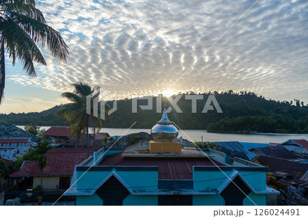 Sunset over Pulau Papan mosque and village, Malenge, Sulawesi, Indonesia Sunset over Pulau Papan mosque and village, Malenge, Sulawesi, Indonesia 126024491