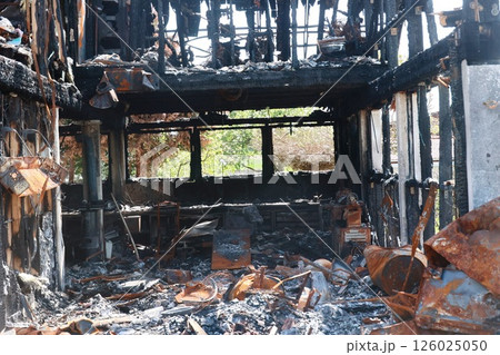 A building is on fire and the inside is filled with debris A building is on fire and the inside is filled with debris 126025050