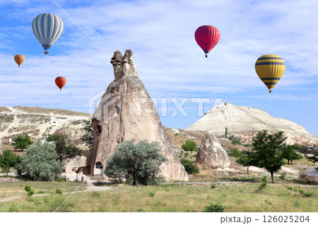 Balloon flight, famous tourist attraction of Cappadocia. Air balloons and Fairy Chimney in Pasabag Valley, Anatolia, Turkey. Topic of vacation, travel, trip abroad on vacation, cruises and tours 126025204