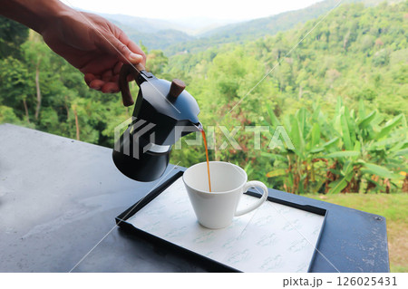 coffee, americano or hot americano coffee or pouring coffee or moka pot coffee or hot coffee 126025431