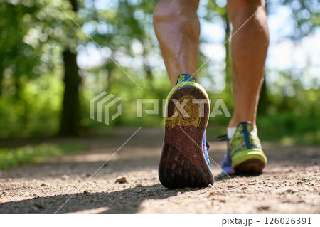 Runner shoes close-up on forest trail during outdoor workout 126026391