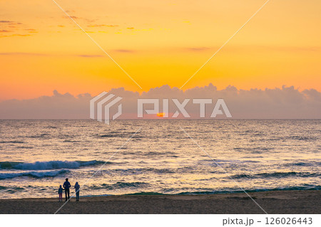 sunrise at the sea in summer with sun and cloudscape above horizon. vacation and relax scenery at twilight. dramatic weather 126026443