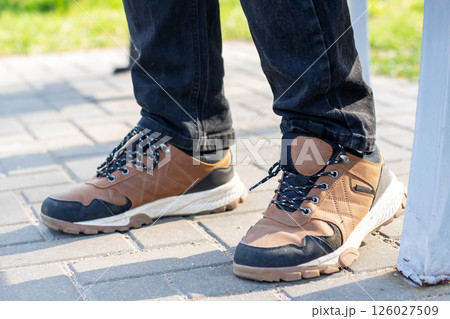 A person is wearing a stylish pair of brown and black shoes today 126027509