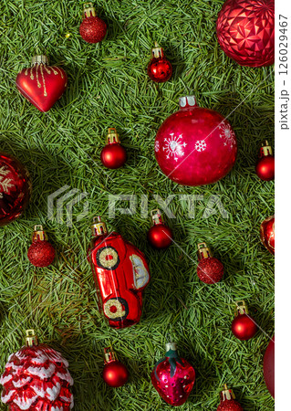 Red Christmas tree glass ball toys on green Red Christmas tree glass ball toys on green 126029467