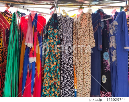 Colorful Traditional Women's Dresses on Display at a Street Market in Senegal Colorful Traditional Women's Dresses on Display at a Street Market in Senegal 126029744