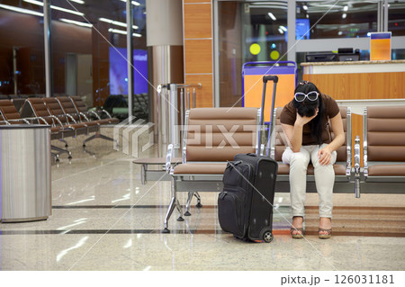 Woman was late for a plane or train flight or it was canceled. Woman was late for a plane or train flight or it was canceled. 126031181