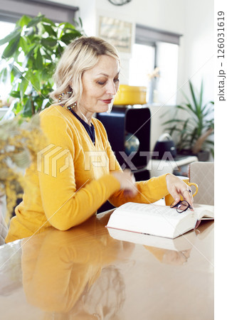 an adult woman working in home interior, lifestyle people concept an adult woman working in home interior, lifestyle people concept 126031619