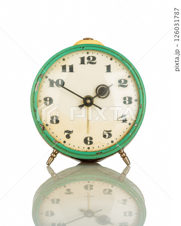 Old Analog alarm clock on a white background... Old Analog alarm clock on a white background... 126031787