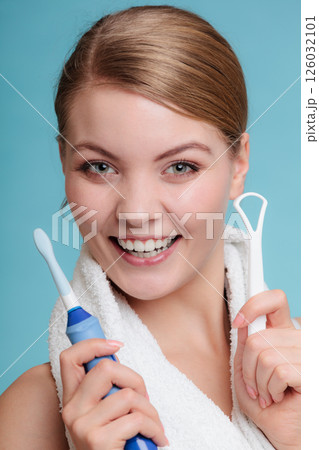 Girl with brush and tongue cleaner. Girl with brush and tongue cleaner. 126032101
