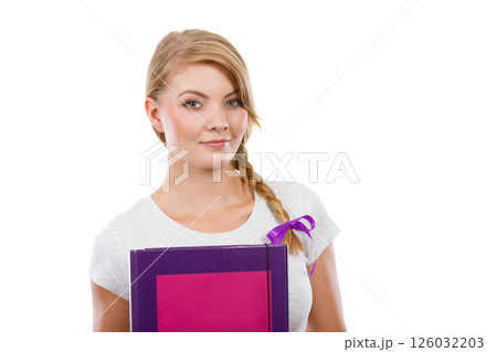 Young teenage student with braid holding books Young teenage student with braid holding books 126032203